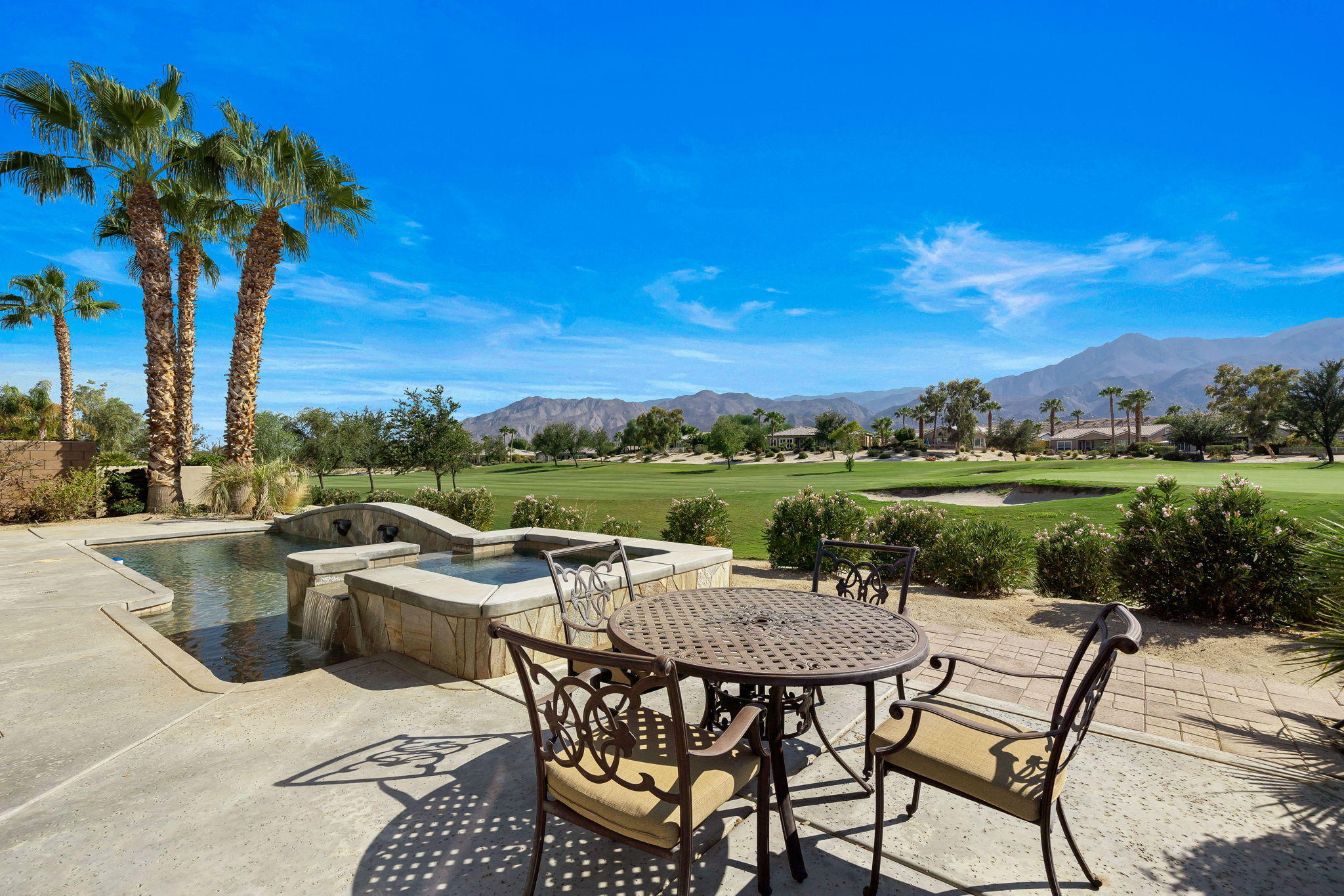81189 Red Rock Road La Quinta, CA 92253 - Photo 3 of 85 a view of a terrace with furniture and a yard