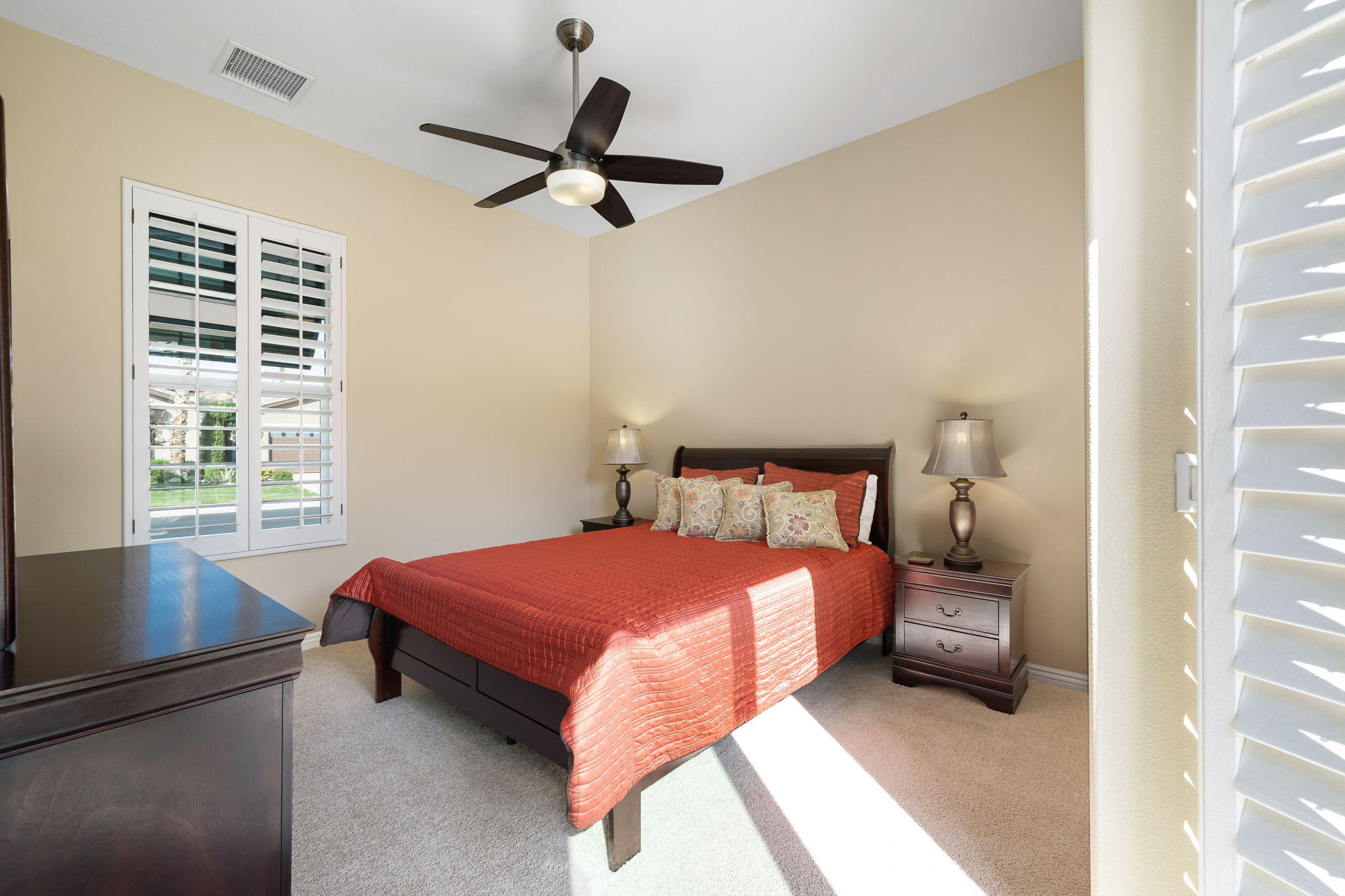 81189 Red Rock Road La Quinta, CA 92253 - Photo 31 of 85 a bedroom with a bed and a window