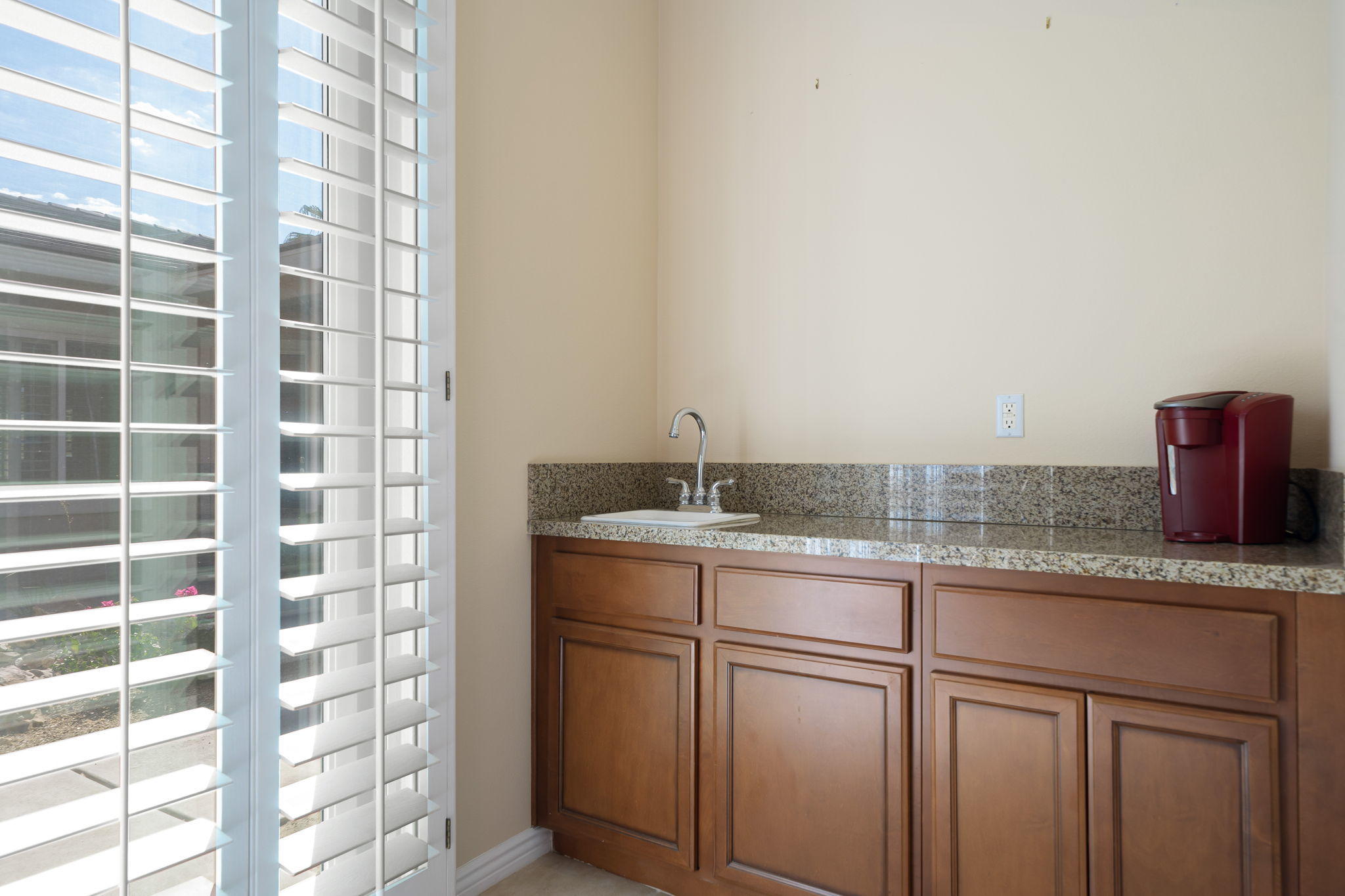 81189 Red Rock Road La Quinta, CA 92253 - Photo 32 of 85 a bathroom with a granite countertop sink and a mirror