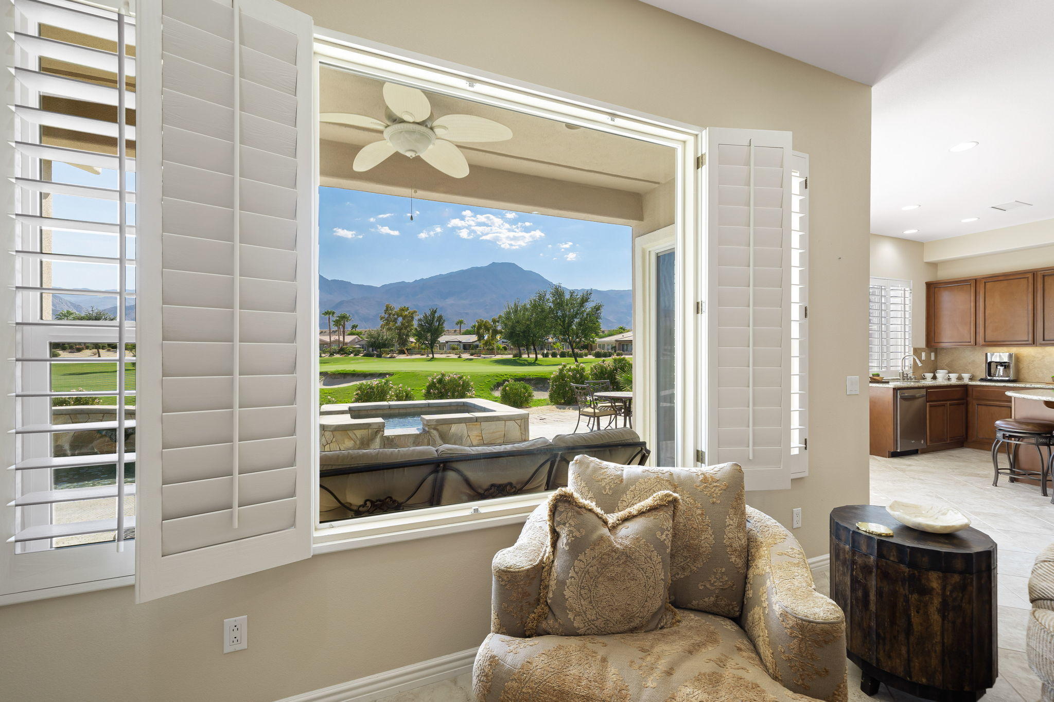 81189 Red Rock Road La Quinta, CA 92253 - Photo 7 of 85 a living room with furniture and a floor to ceiling window