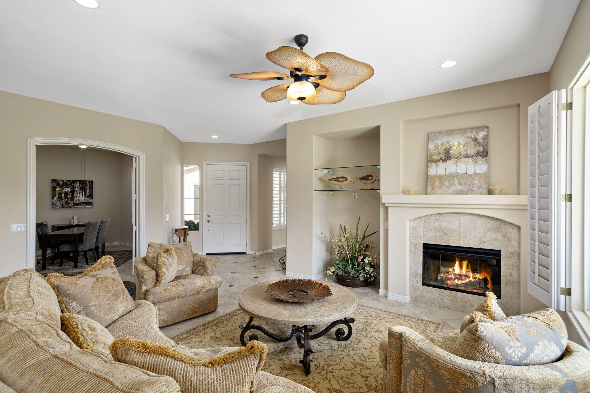 81189 Red Rock Road La Quinta, CA 92253 - Photo 8 of 85 a living room with furniture a fireplace and a chandelier