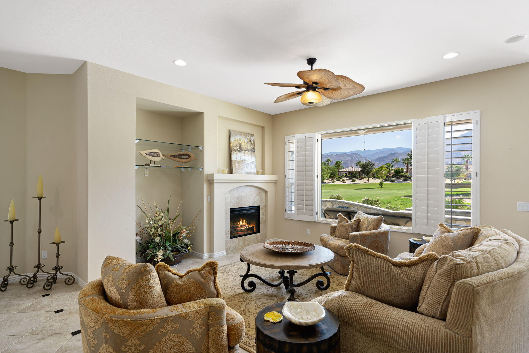 81189 Red Rock Road La Quinta, CA 92253 - Photo 9 of 85 a living room with furniture potted plant and a fireplace