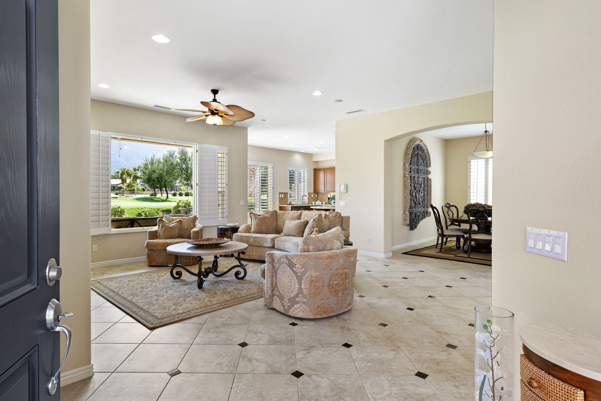 81189 Red Rock Road La Quinta, CA 92253 - Photo 10 of 85 a living room with furniture a window and a flat screen tv
