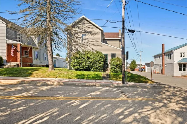 a view of a street with a building in the background