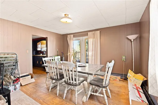 a view of a dining room with furniture and a window