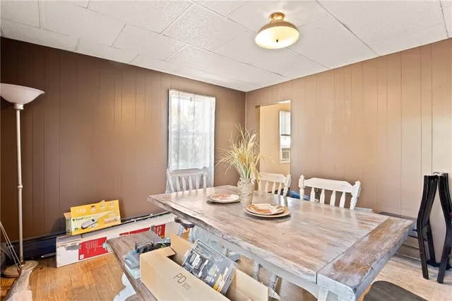 a kitchen view of a kitchen island wooden cabinets and refrigerator