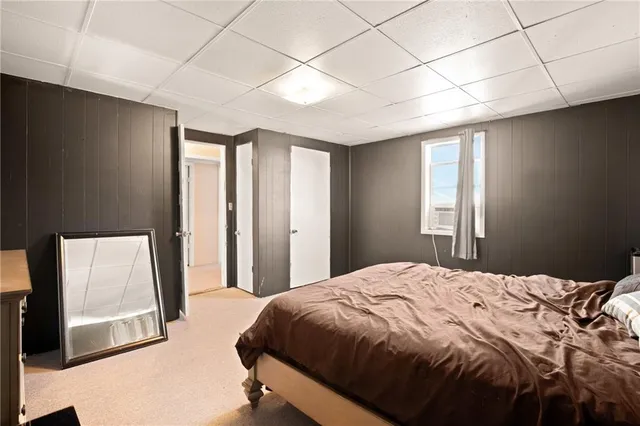 a bathroom with a toilet a sink and a mirror