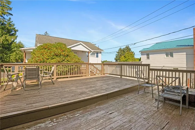 a view of a house with outdoor seating