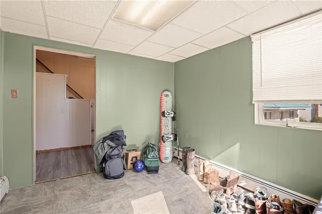 a bedroom with bed and a window