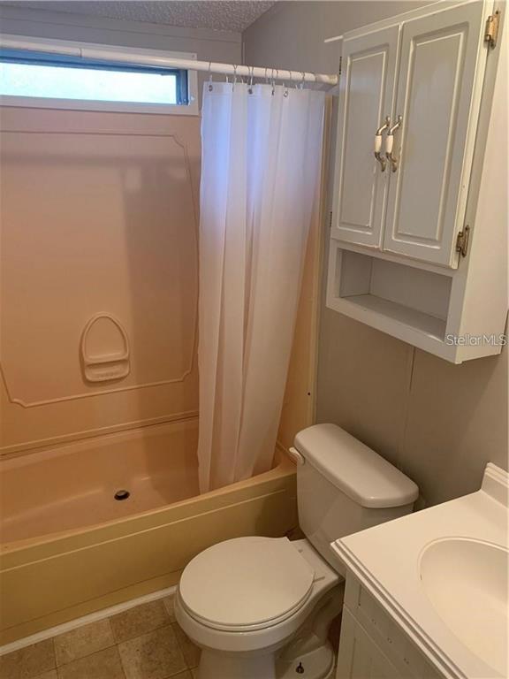 8719 Lithia Pinecrest Road Lithia, FL 33547 - Photo 15 of 21 a bathroom with a toilet and a shower