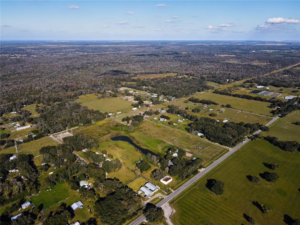 8719 Lithia Pinecrest Road Lithia, FL 33547 - Photo 6 of 21 an aerial view of residential houses with outdoor space