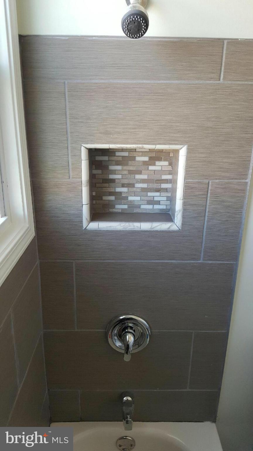 8030 Gray Haven Road Baltimore, MD 21222 - Photo 19 of 30 a bathroom with a shower