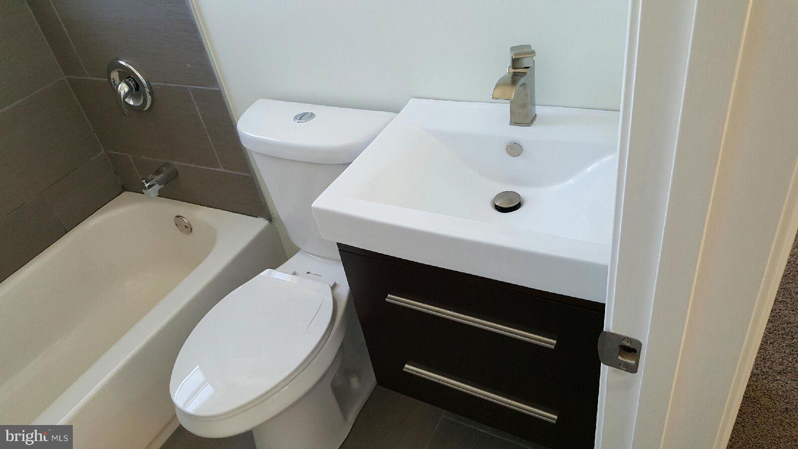 8030 Gray Haven Road Baltimore, MD 21222 - Photo 20 of 30 a bathroom with a sink and a toilet