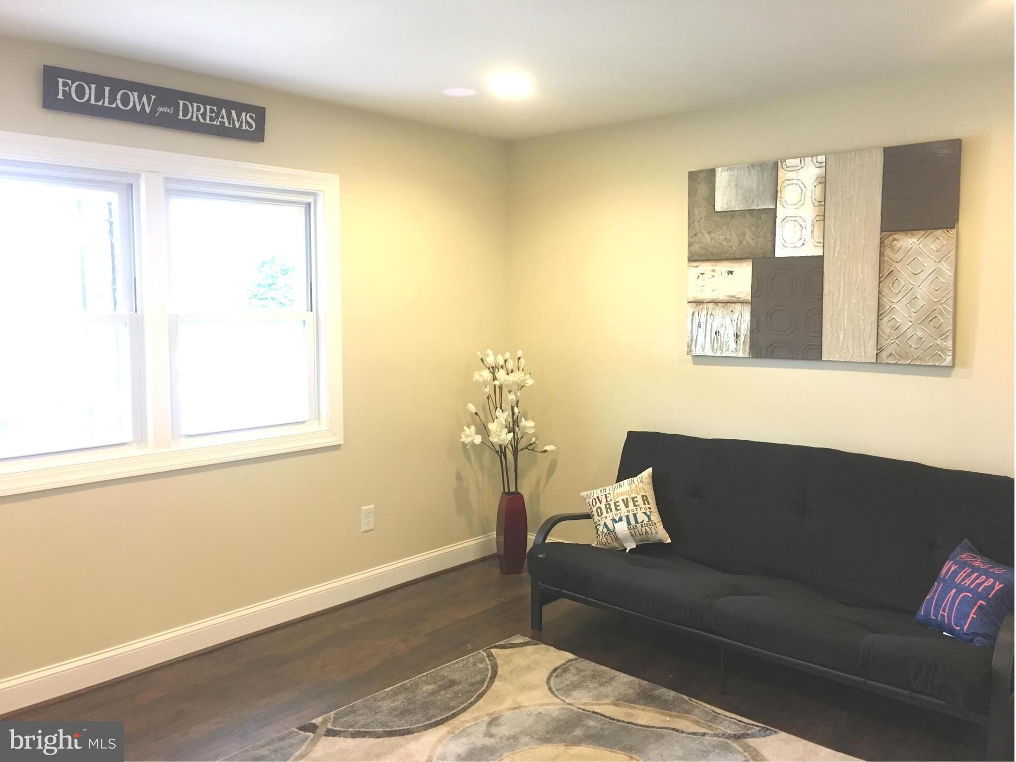 8030 Gray Haven Road Baltimore, MD 21222 - Photo 3 of 30 a living room with furniture and a window