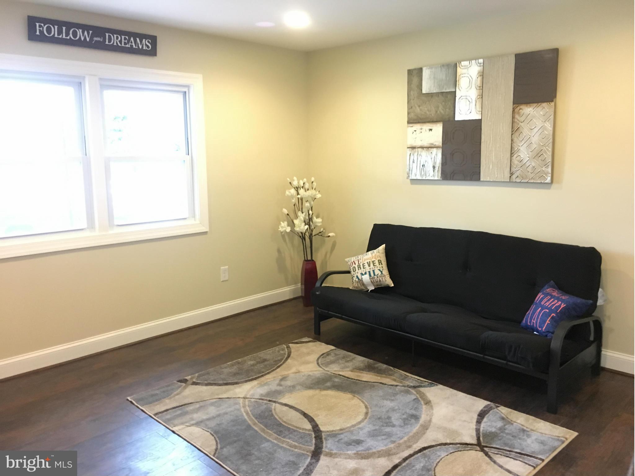 8030 Gray Haven Road Baltimore, MD 21222 - Photo 5 of 30 a living room with furniture and a window