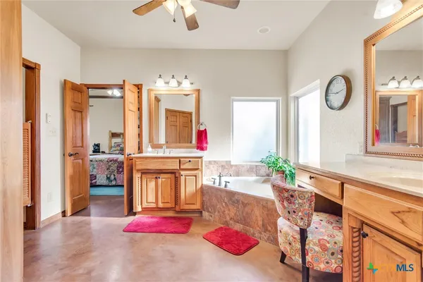 a living room with furniture and large windows