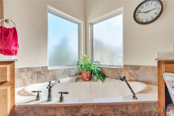 a white bath tub sitting in a bathroom