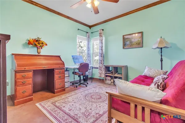 a living room with furniture and a rug