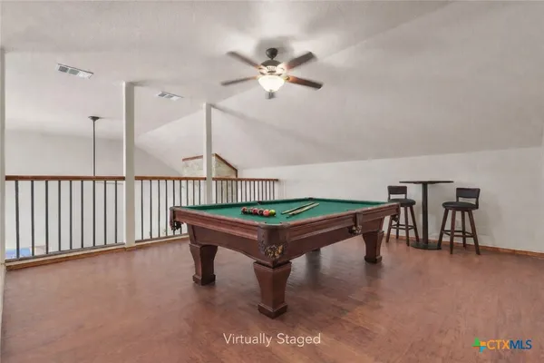 a room with table soccer and windows
