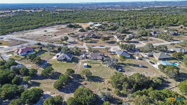 an aerial view of residential house with outdoor space