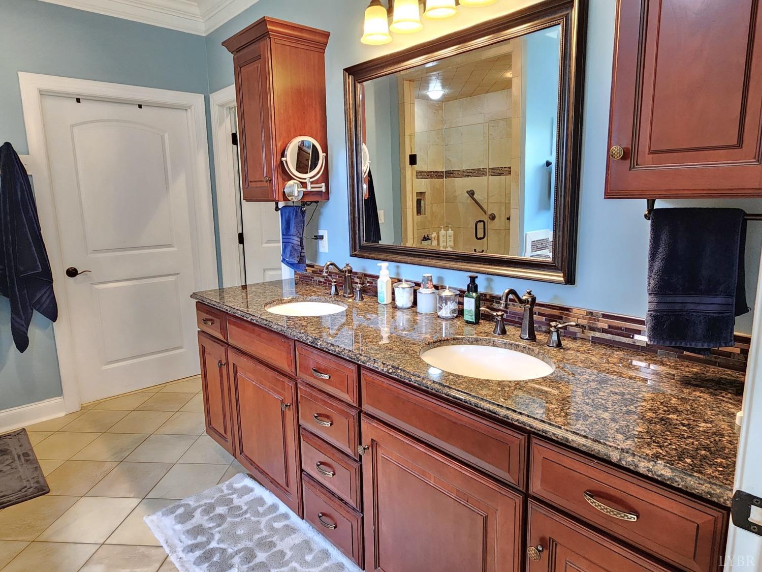623 Two Bid Road Evington, VA 24550 - Photo 41 of 97 a bathroom with a granite countertop double vanity sink and mirror