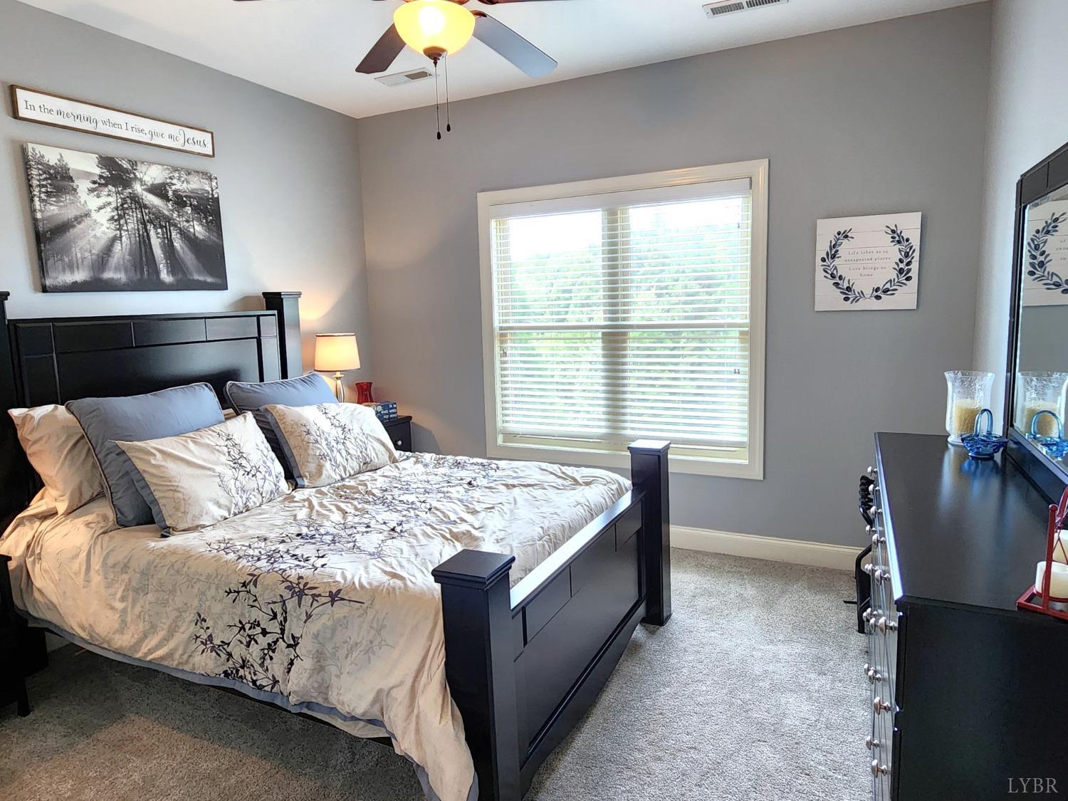 623 Two Bid Road Evington, VA 24550 - Photo 48 of 97 a bed sitting in a bedroom next to a window