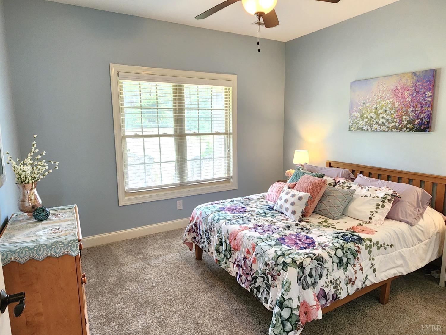 623 Two Bid Road Evington, VA 24550 - Photo 50 of 97 a bed sitting in a bedroom next to a window