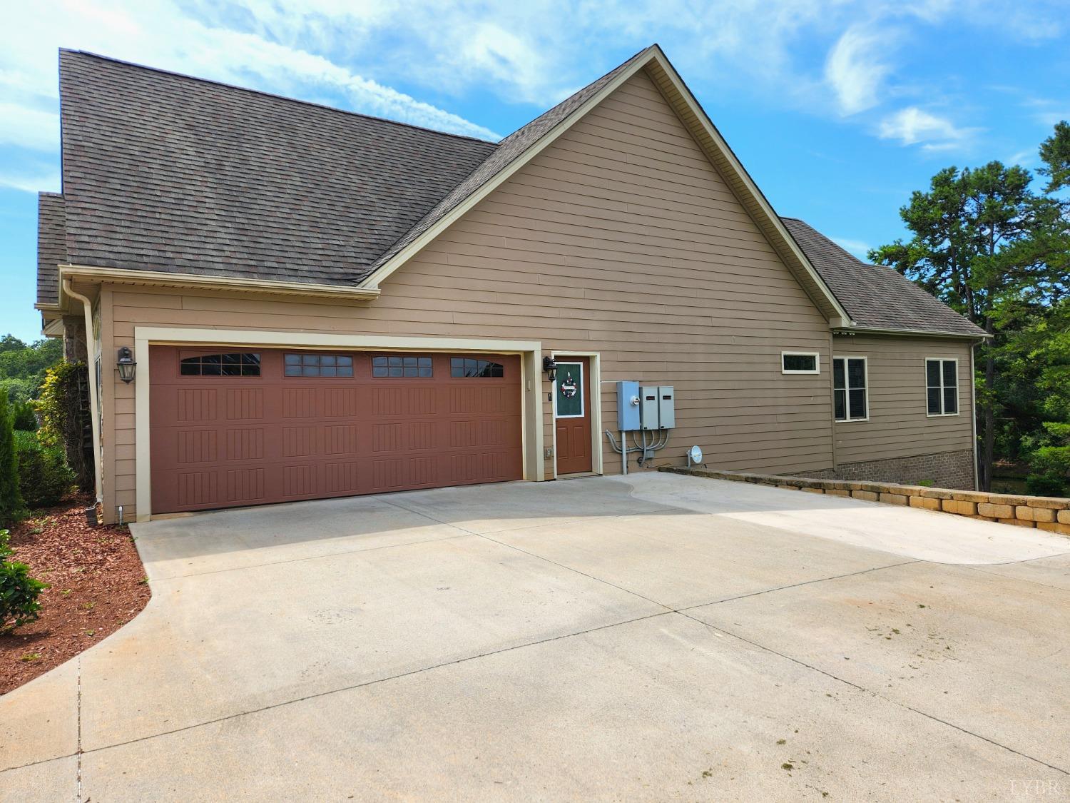 623 Two Bid Road Evington, VA 24550 - Photo 5 of 97 a front view of a house with a garage