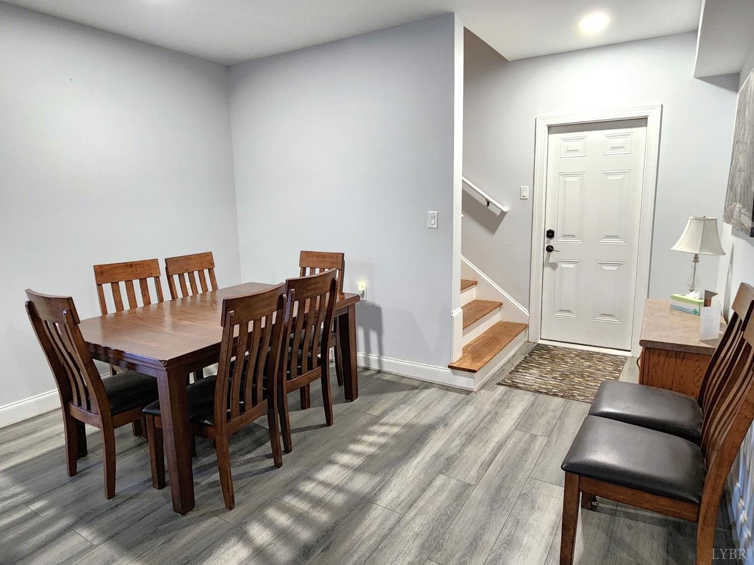 623 Two Bid Road Evington, VA 24550 - Photo 59 of 97 a view of a dining room with furniture and wooden floor