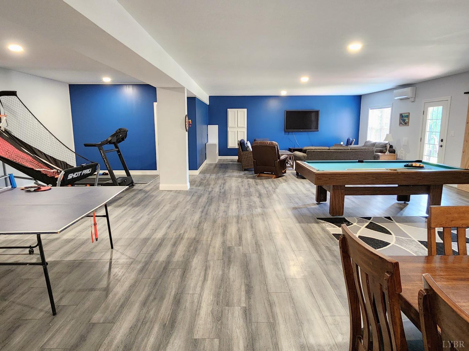 623 Two Bid Road Evington, VA 24550 - Photo 60 of 97 a view of a workspace with furniture a rug and wooden floor