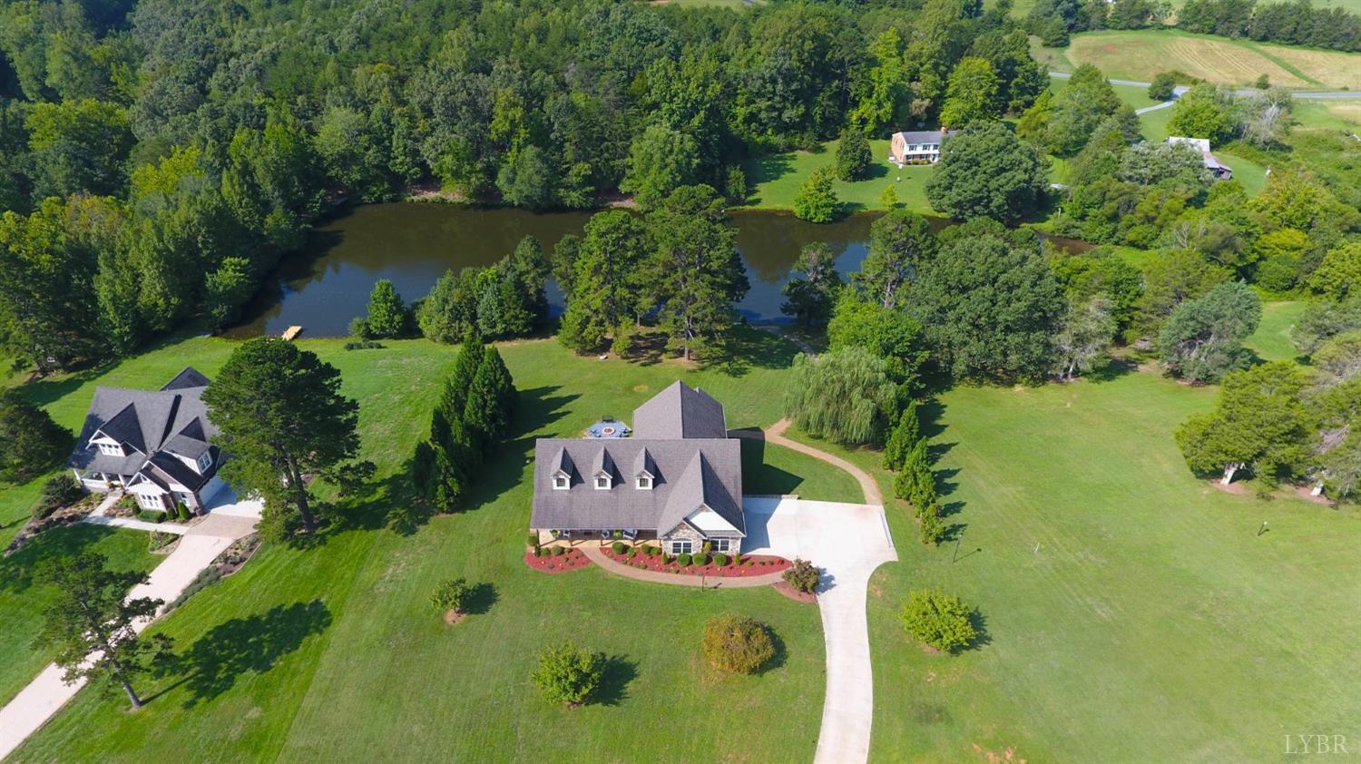 623 Two Bid Road Evington, VA 24550 - Photo 6 of 97 an aerial view of a house with a yard lake lake and green space