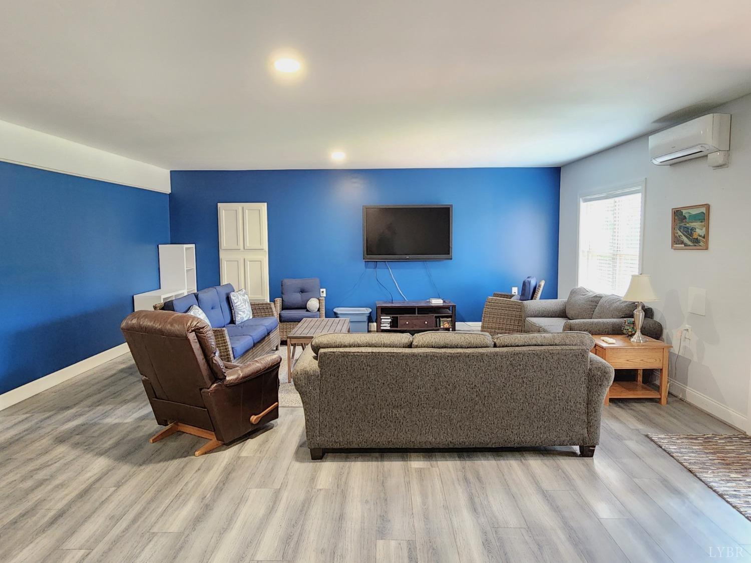 623 Two Bid Road Evington, VA 24550 - Photo 63 of 97 a living room with furniture and a flat screen tv