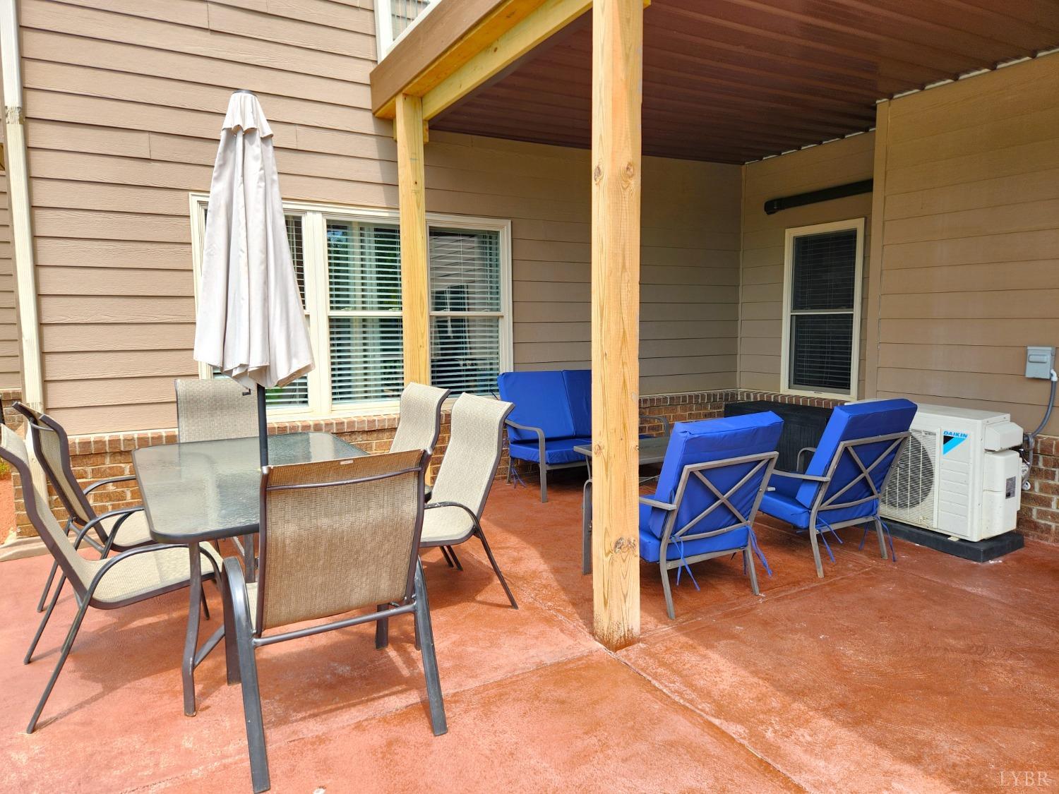 623 Two Bid Road Evington, VA 24550 - Photo 78 of 97 a view of a house with patio and a couple of chairs