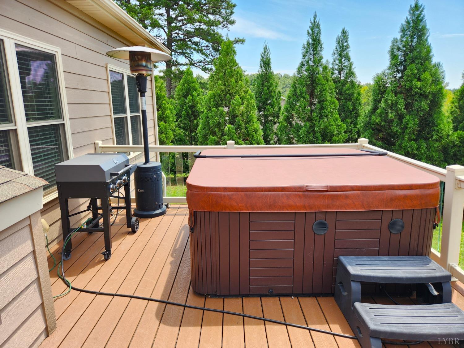 623 Two Bid Road Evington, VA 24550 - Photo 83 of 97 a view of a patio with table and chairs with wooden floor and fence
