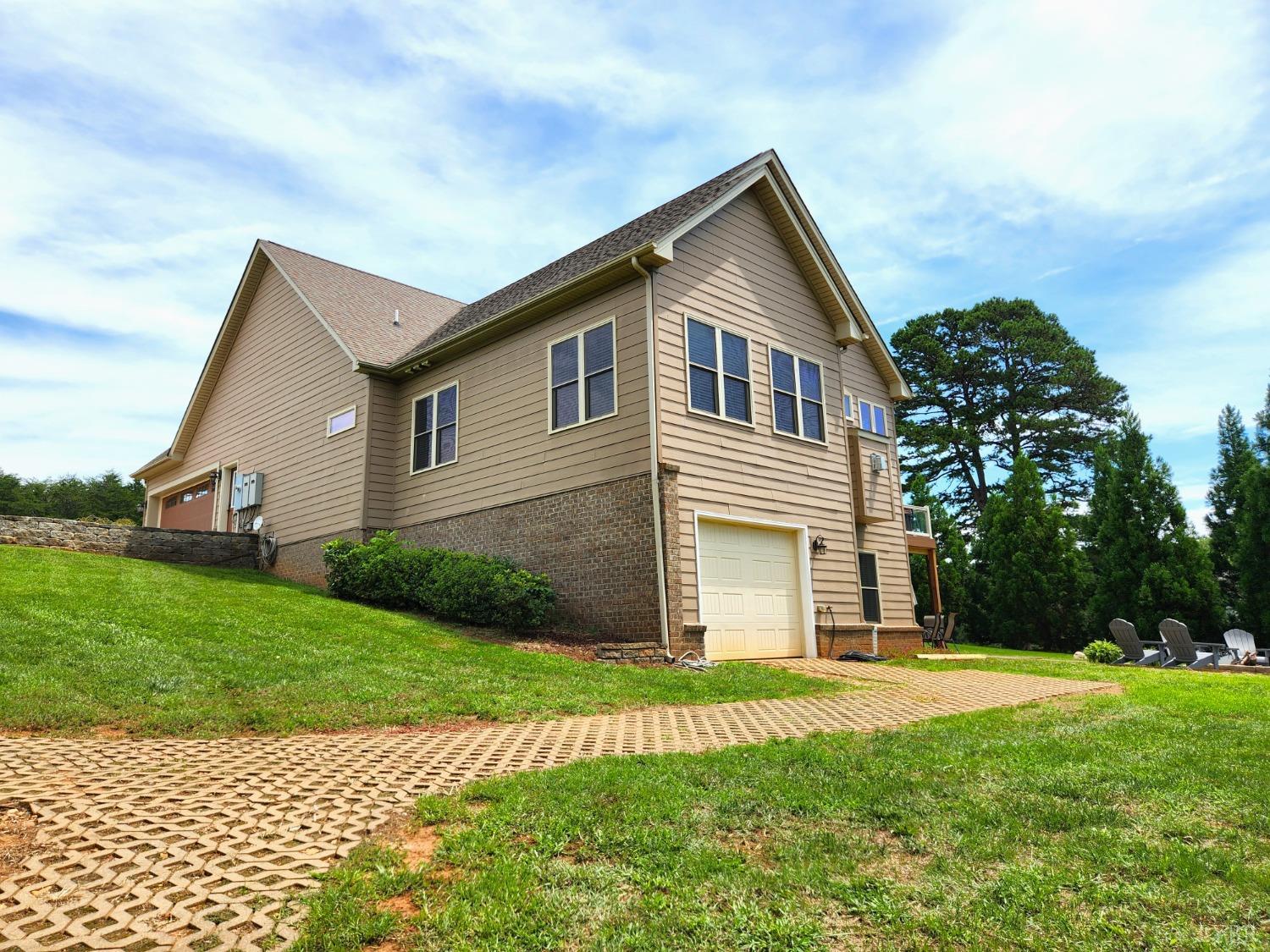 623 Two Bid Road Evington, VA 24550 - Photo 88 of 97 a front view of a house with a yard and garage