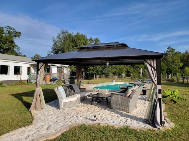 a view of swimming pool with outdoor seating