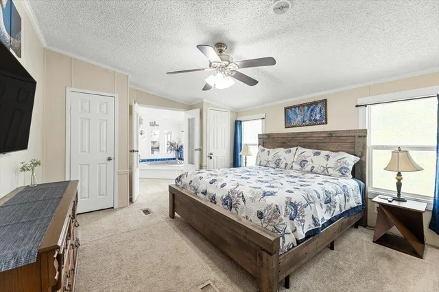 a bedroom with a bed and a mirror