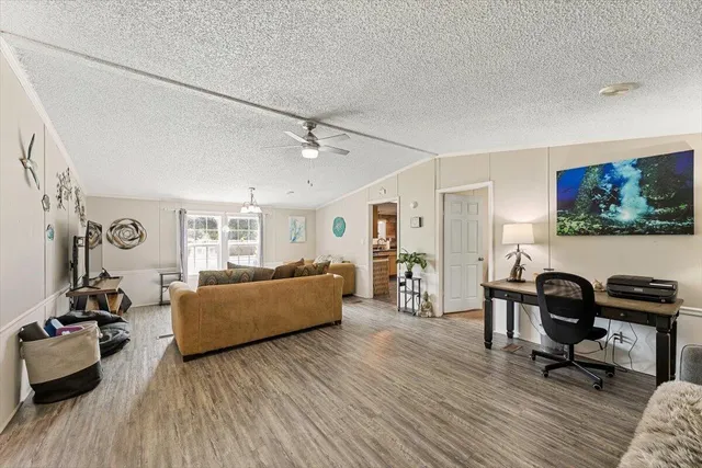 a bedroom with a bed and a table