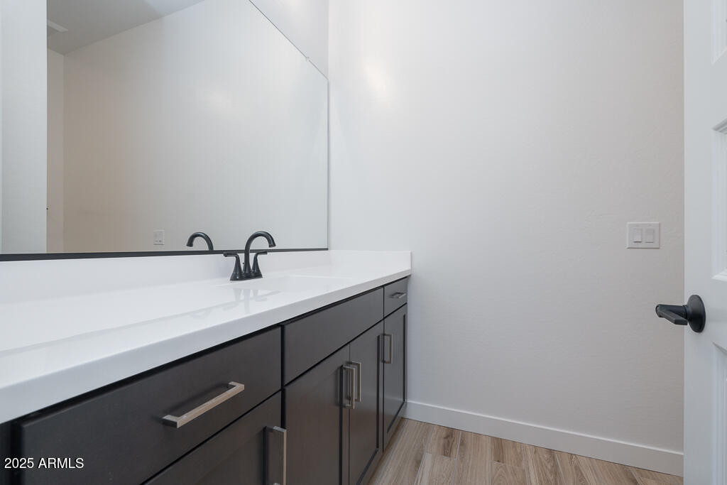 800 West J. Waltz Way Apache Junction, AZ 85120 - Photo 14 of 22 a bathroom with a sink and mirror