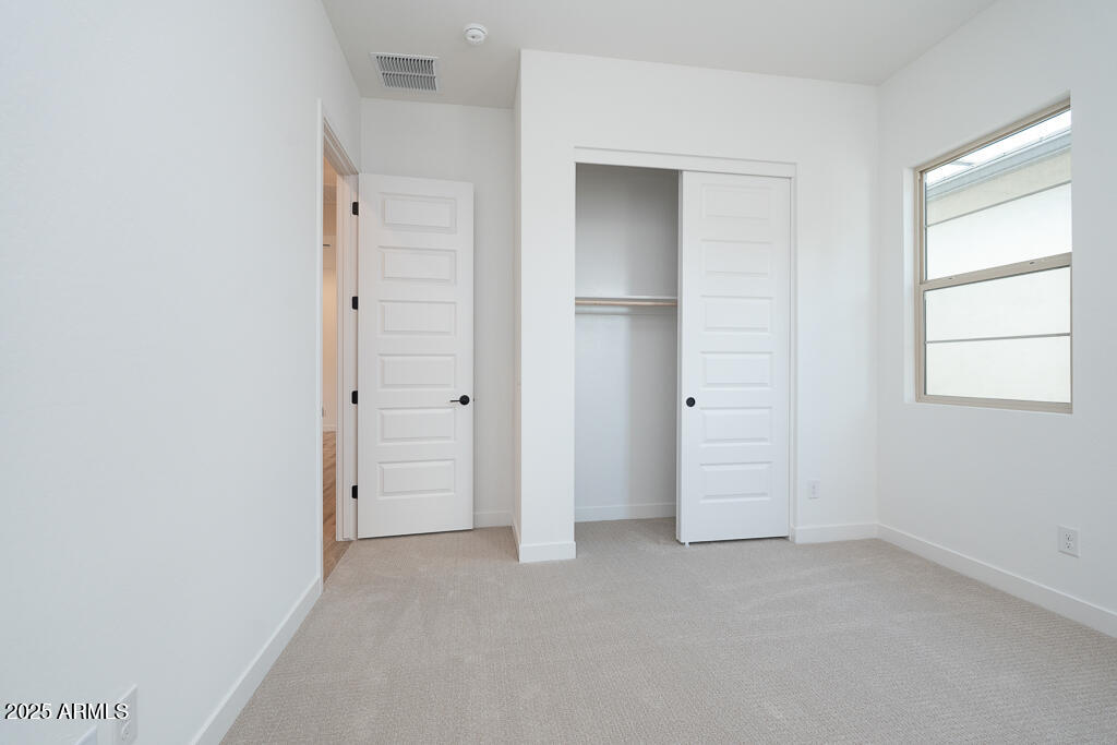 800 West J. Waltz Way Apache Junction, AZ 85120 - Photo 15 of 22 an empty room that has a grey walls