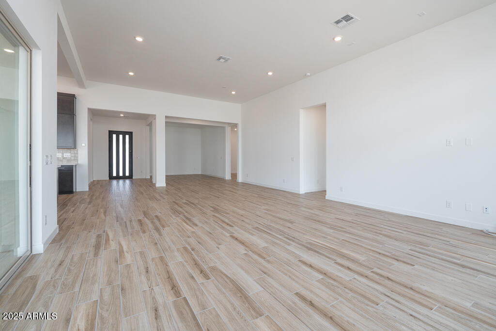 800 West J. Waltz Way Apache Junction, AZ 85120 - Photo 6 of 22 a view of empty room with wooden floor
