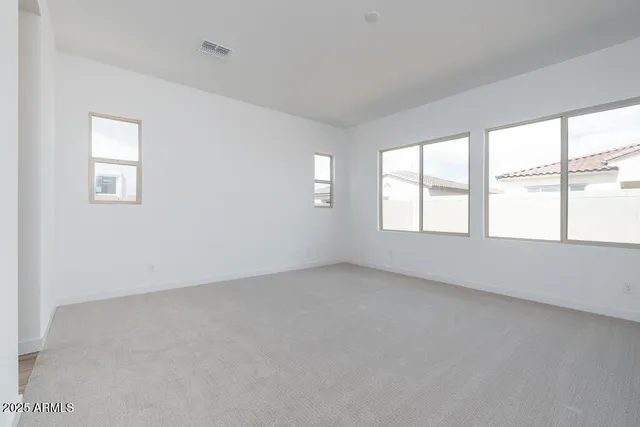 an empty room with windows
