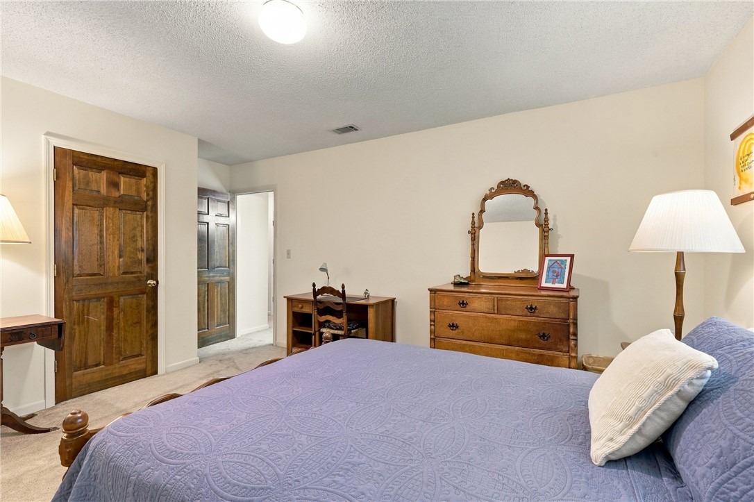 7 Woodbridge Circle Anderson, SC 29621 - Photo 18 of 26 Plush carpeting and solid wood doors create a warm, inviting atmosphere in this bedroom.