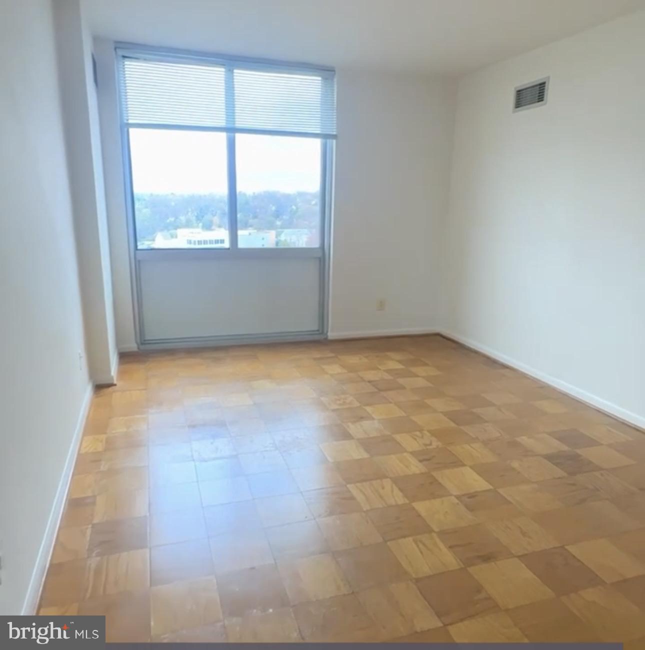 5101 River Road, Unit 1103 Bethesda, MD 20816 - Photo 12 of 22 an empty room with a window