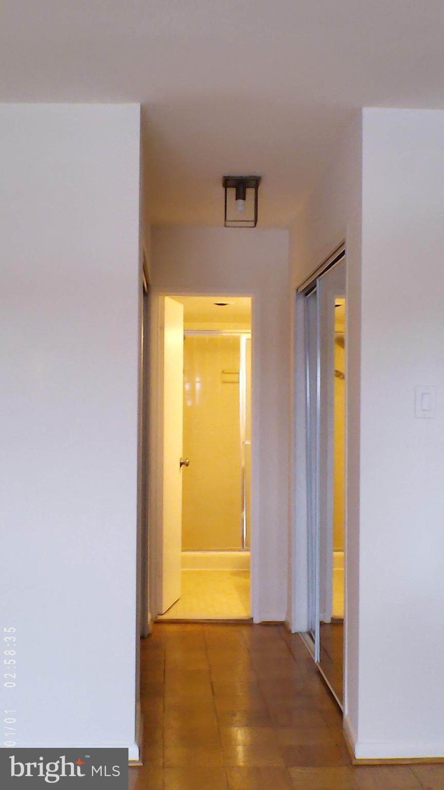 5101 River Road, Unit 1103 Bethesda, MD 20816 - Photo 6 of 22 a view of a bathroom with a door