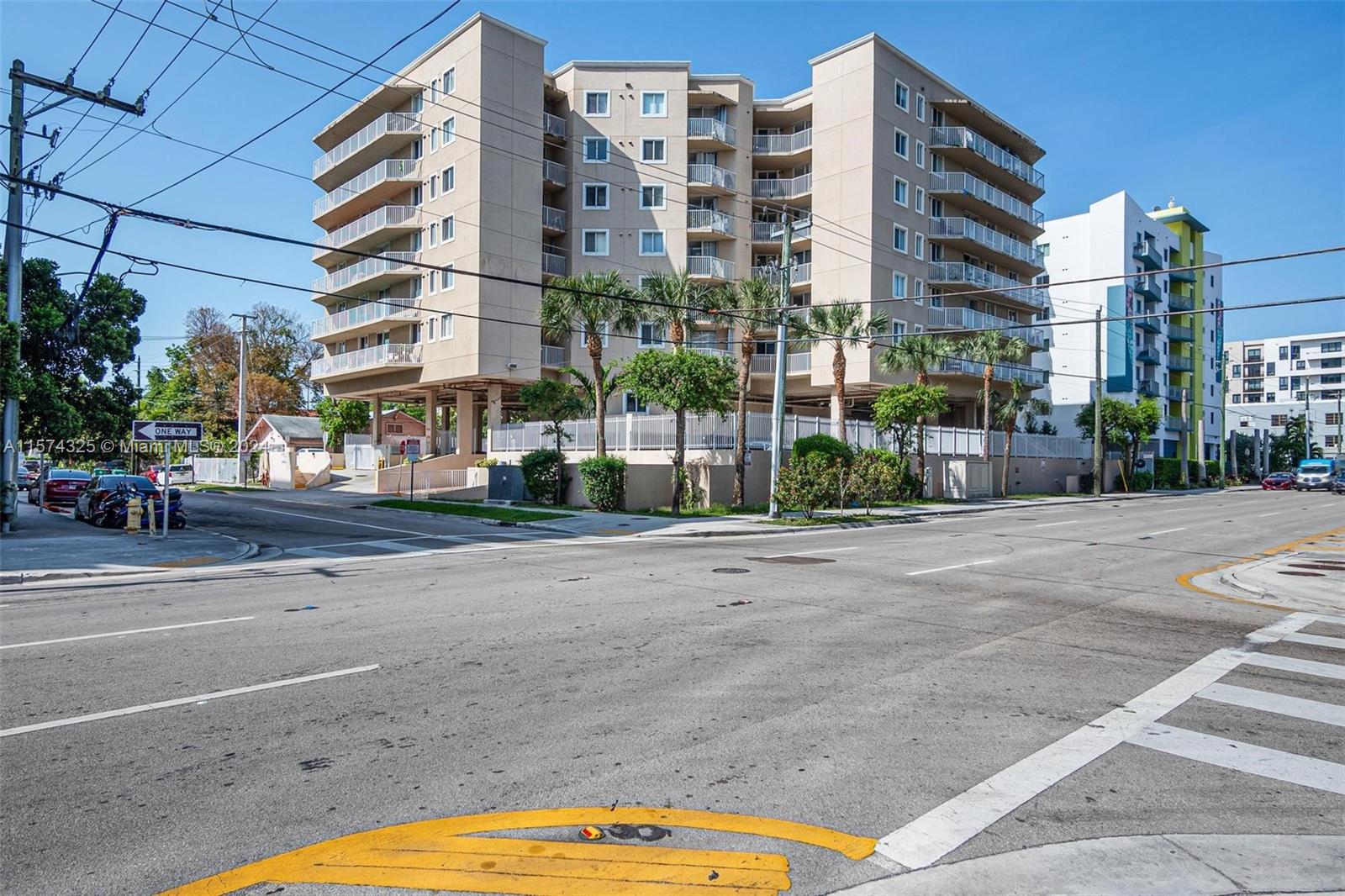 102 Southwest 6th Avenue, Unit 401 Miami, FL 33130 - Photo 1 of 27 a city street lined with buildings and trees