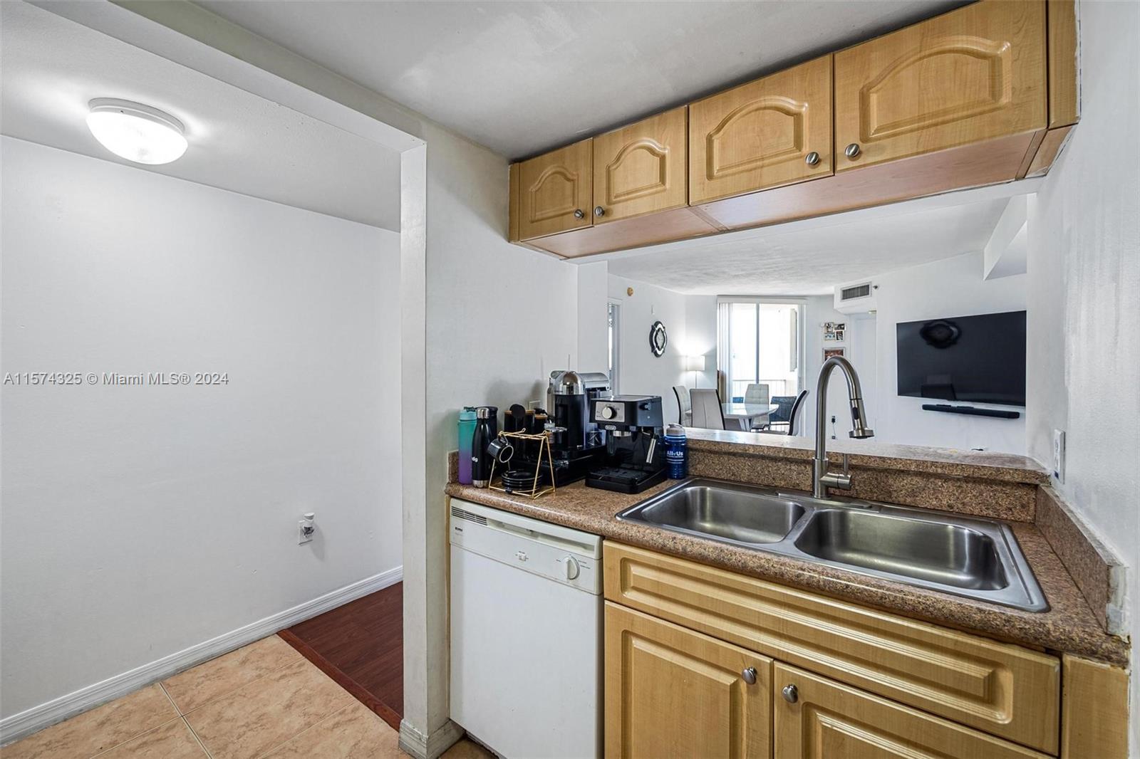 102 Southwest 6th Avenue, Unit 401 Miami, FL 33130 - Photo 11 of 27 a kitchen with a sink and cabinets