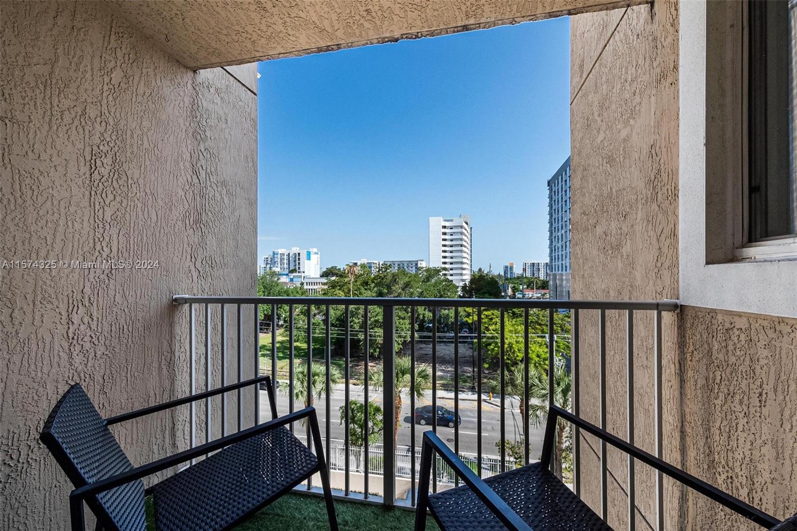 102 Southwest 6th Avenue, Unit 401 Miami, FL 33130 - Photo 13 of 27 a view of balcony with wooden floor