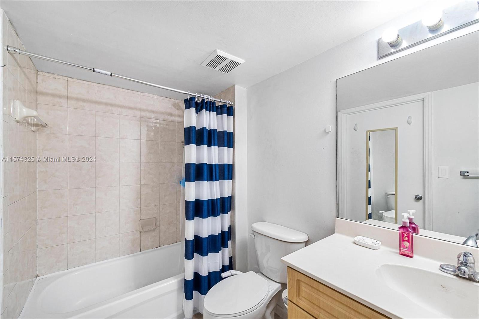 102 Southwest 6th Avenue, Unit 401 Miami, FL 33130 - Photo 18 of 27 a bathroom with a sink toilet and shower