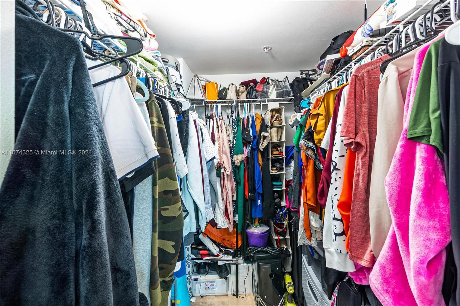 102 Southwest 6th Avenue, Unit 401 Miami, FL 33130 - Photo 19 of 27 a view of walk in closet with clothes